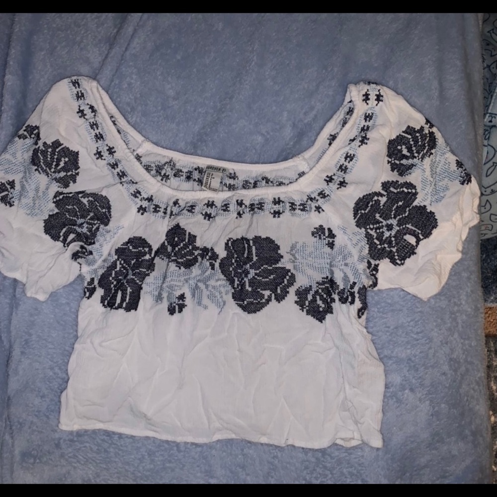 Off the shoulder blue and white crop top.